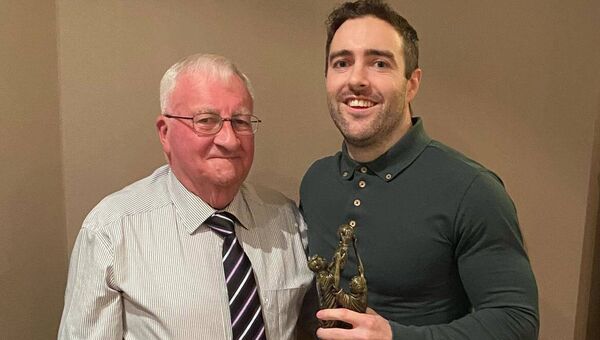 Marty Horkan presenting Fergal Quinn with the Senior Player of the Year award at the recent Charlestown Sarsfields GAA dinner dance held in the Yeats County Inn Curry recently. Marty Horkan presenting Fergal Quinn with the Senior Player of the Year award at the recent Charlestown Sarsfields GAA dinner dance held in the Yeats County Inn Curry recently.