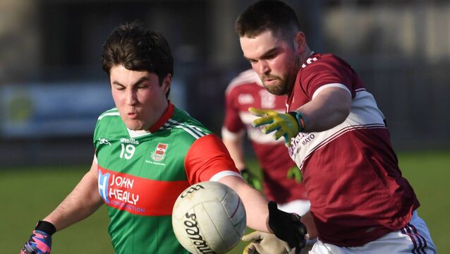 <p>Ballina's Thomas Leonard in action against Crossmolina’s Ferghal Duffy during the Sweeney Cup senior football final at James Stephens Park last Saturday evening	Picture: David Farrell Photography </p>