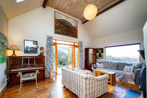 The spacious and attractive living room area of the unique cottage