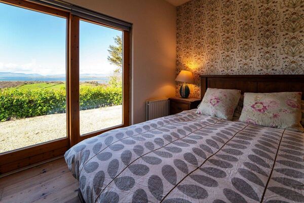 The master bedroom of the three bedroom home has a stunning backdrop and scenery
