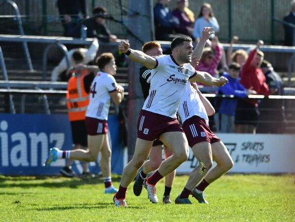 Galway's Damien Comer celebrates Robert Finnerty (background) scoring the match-winning goal.