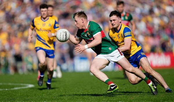 Ryan O’Donoghue, who was the game's top scorer, takes on Roscommon full-back Brian Stack.