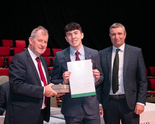 Sponsor JP McManus and Minister Collins presenting All Ireland Scholarship Award to Kevin Gillespie, St. Muredach's College, Mayo.