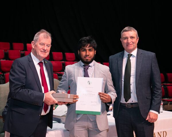 Sponsor JP McManus and Minister Collins presenting All Ireland Scholarship Award to Al-Mahi Tanzeem, St. Geralds College DLS, Mayo.