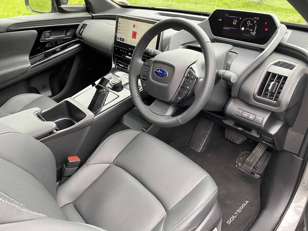 The very stylish but quite dark interior was lightened somewhat by light from the two sunroofs and the grey tweed-like material on the front passenger’s side that stretches across the dash.  The very stylish but quite dark interior was lightened somewhat by light from the two sunroofs and the grey tweed-like material on the front passenger’s side that stretches across the dash.