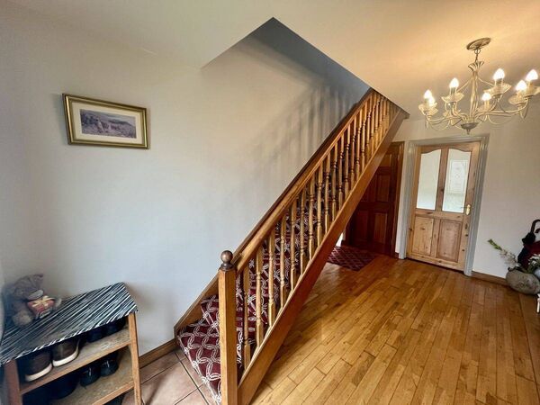 The staircase and hallway of the Doctors Road house