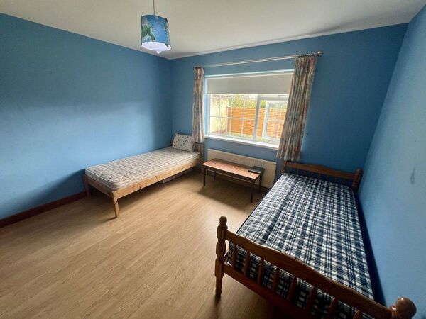 The third bedroom at the house with two single beds