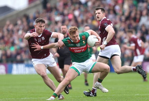 Jack Carney attempts to break free from the clutches of Galway's Matthew Tierney.