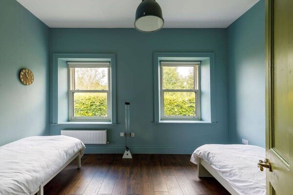 There are two twin single beds in the fourth bedroom