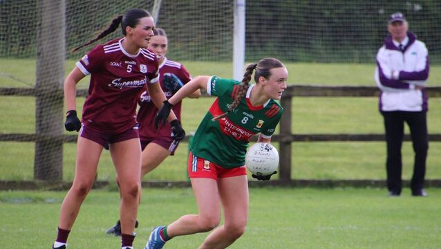 <p>Galway defender Aisling Murray can only watch as Sarah Carney looks to send Mayo on the attack during last Saturday's epic final in Bekan.	Picture: Pauline Flatley</p>
