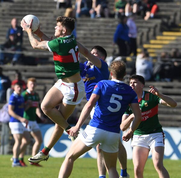 Mayo’s Jordan Flynn climbs high to seize possession.