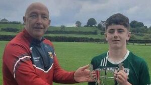 Local Notes: Rhys O'Connor, Charlestown Sarsfields being presented with the U15 Division 2 Feile Cup.
