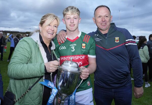 Mayo captain Tom Hession celebrates winning the Tom Kilcoyne Cup with his parents. Mayo captain Tom Hession celebrates winning the Tom Kilcoyne Cup with his parents.