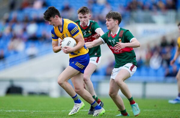 Roscommon's Joe McKeon under pressure from Mayo duo Owen Loughney and Mark Sheeran. Roscommon's Joe McKeon under pressure from Mayo duo Owen Loughney and Mark Sheeran.