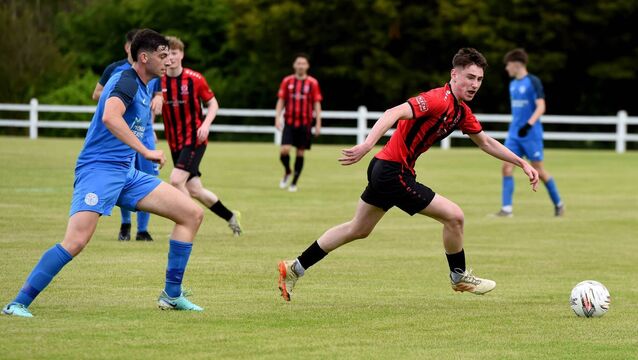 <p>Westport United’s Kevin Ketterick in action against Moyne Villa’s Adam Barrett during the Connacht Shield final at Umbro Park, Castlebar, this afternoon. Picture: David Farrell Photography </p>