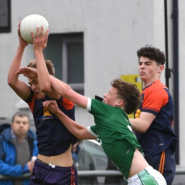 Ardmoy’s Adam Naughton catches the ball firmly in this midfield duel. Picture: David Farrell Photography Ardmoy’s Adam Naughton catches the ball firmly in this midfield duel. Picture: David Farrell Photography