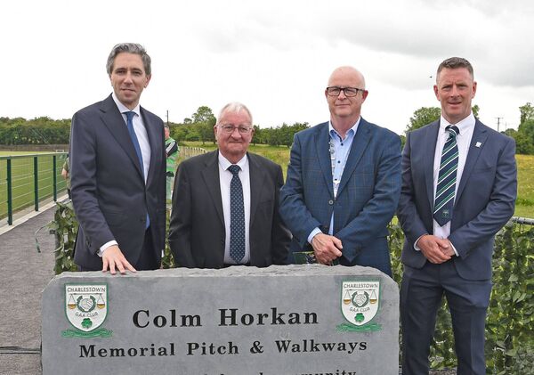 An Taoiseach Simon Harris, Marty Horkan, Cllr Gerry Murray and Liam Breheny, Charlestown Sarsfields chairman. 