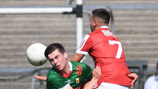 <p>Andrew Quinn collides with Cork’s Cian O’Connor during Mayo's victory in the Electric Ireland All-Ireland MFC quarter-final at Cusack Park, Ennis. The Green and Red face beaten Ulster finalists Armagh at the weekend.	Picture: David Farrell Photography </p>