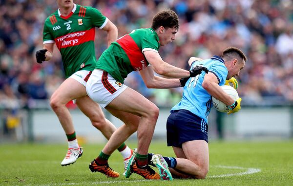 Dublin’s Cormac Costello, whose point to tie the match was his seventh in total, comes under pressure from Mayo's Sam Callinan. Dublin’s Cormac Costello, whose point to tie the match was his seventh in total, comes under pressure from Mayo's Sam Callinan.