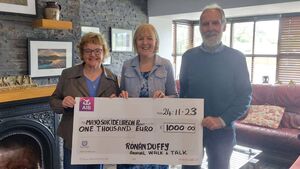 Local Notes: Una and Gerry Duffy, Doocastle, present €1000 to the Family Life Centre, Castlebar, following 'Walk and Talk' event in memory of their son Ronan.