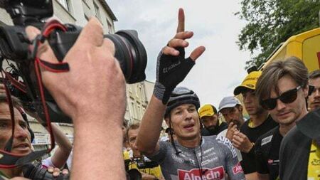 Jasper Philipsen holds off Wout Van Aert to win stage 13 sprint after late crash