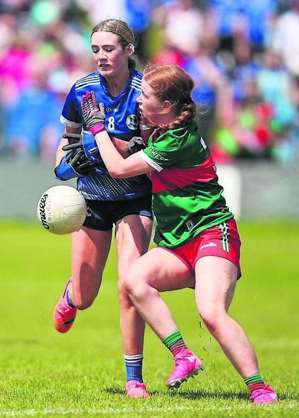 Emilia Mussi, of Cavan, is tackled by Mayo defender Cliona Cullen. Emilia Mussi, of Cavan, is tackled by Mayo defender Cliona Cullen.