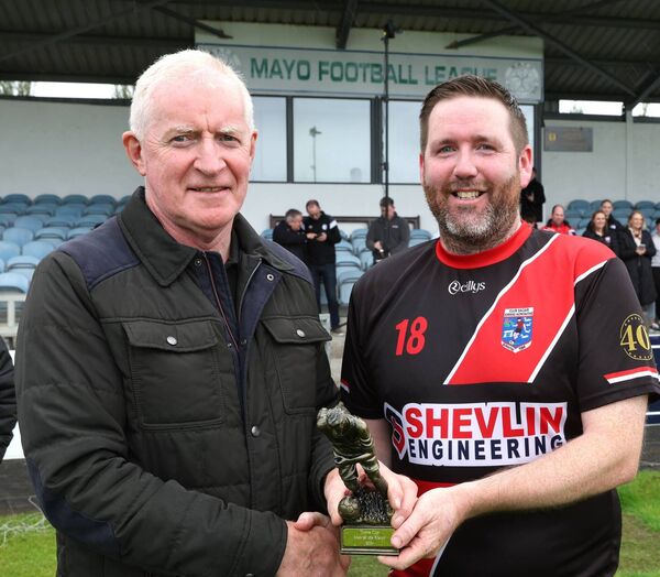 Pat Tonra presents the Tonra Cup Man of the Match" award to Iorras Aontaithe's Ivan Barrett after defeating Swinford in Tonra Cup Final in Umbro Park. Pat Tonra presents the Tonra Cup Man of the Match" award to Iorras Aontaithe's Ivan Barrett after defeating Swinford in Tonra Cup Final in Umbro Park.