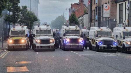 Four men charged over violence after anti-immigration protests in Belfast