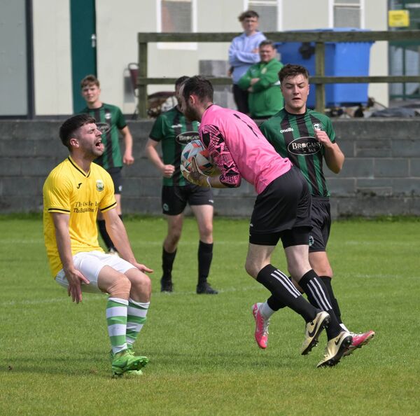 Conn Rangers goalkeeper Brian McMahon collects the ball despite the challenge of Castlebar Celtic's Johnnie Cocozza. Picture: John Corless Conn Rangers goalkeeper Brian McMahon collects the ball despite the challenge of Castlebar Celtic's Johnnie Cocozza. Picture: John Corless