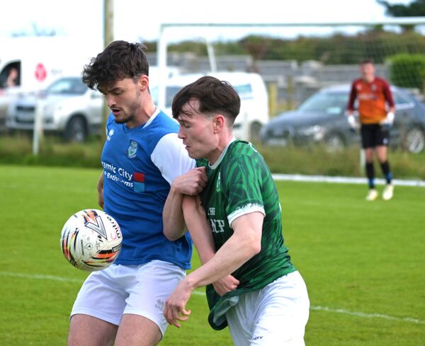 Manulla's Ruairi Henry shields the ball from Ryan McLoughlin of Claremorris. Picture: John Corless Manulla's Ruairi Henry shields the ball from Ryan McLoughlin of Claremorris. Picture: John Corless