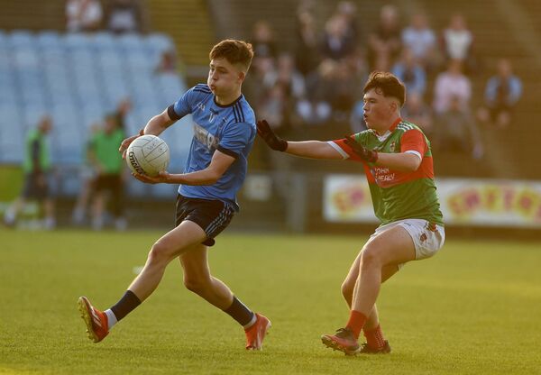 Westport’s Darragh Dawson gets a pass away ahead of Ballina’s Daire O’Connor. Picture: Conor McKeown Westport’s Darragh Dawson gets a pass away ahead of Ballina’s Daire O’Connor. Picture: Conor McKeown