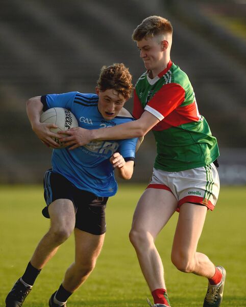 Westport’s Jack Collins attempts to get past Ballina’s Conor Mayock. Picture: Conor McKeown Westport’s Jack Collins attempts to get past Ballina’s Conor Mayock. Picture: Conor McKeown