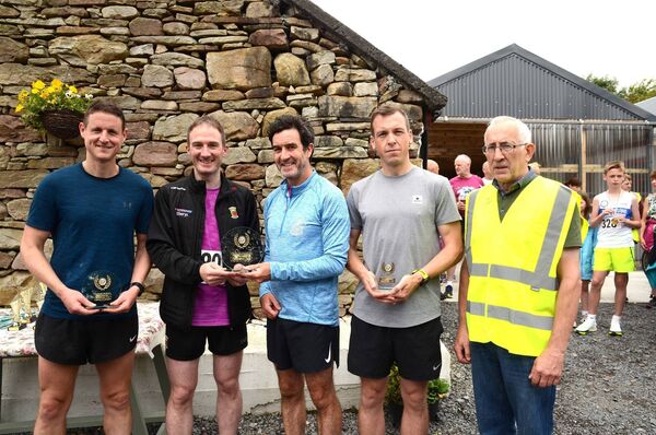 Senior 10K male prizewinners. From left, Paul Conlon (2nd), Minister Allan Dillon T.D, Dan Charlton (1st), Daniel McGing (3rd), Seamus Moylette, Islandeady Cycling Club. Senior 10K male prizewinners. From left, Paul Conlon (2nd), Minister Allan Dillon T.D, Dan Charlton (1st), Daniel McGing (3rd), Seamus Moylette, Islandeady Cycling Club.