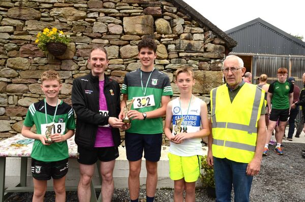 Junior 5K Male prizewinners. From left, Aaron Gibbons (3rd), Minister Alan Dillon, Padraig McDonagh (1st), Owen McMahon (2nd), Seamus Moylette, Islandeady Cycling Club. Junior 5K Male prizewinners. From left, Aaron Gibbons (3rd), Minister Alan Dillon, Padraig McDonagh (1st), Owen McMahon (2nd), Seamus Moylette, Islandeady Cycling Club.