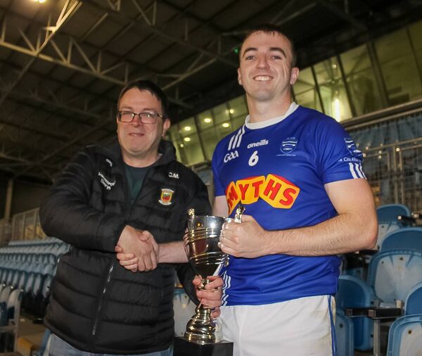 Mayo GAA vice-chairman Con Moynihan presenting the trophy to Claremorris captain Brian Quinn. Picture: SJ Walsh Photography Mayo GAA vice-chairman Con Moynihan presenting the trophy to Claremorris captain Brian Quinn. Picture: SJ Walsh Photography