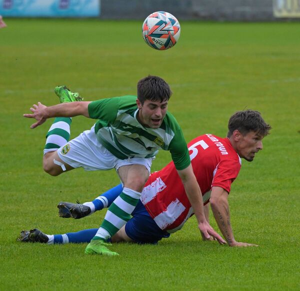 Castlebar Celtic's Johnnie Cocozza gets away from Ballina Town's Chris Moore. Picture: John Corless