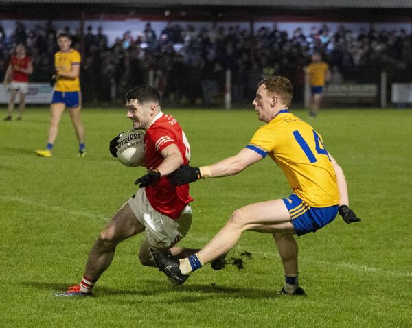 Garrymore defender Colin Commins looks for a way past his Knockmore marker Aiden Orme. Garrymore defender Colin Commins looks for a way past his Knockmore marker Aiden Orme.