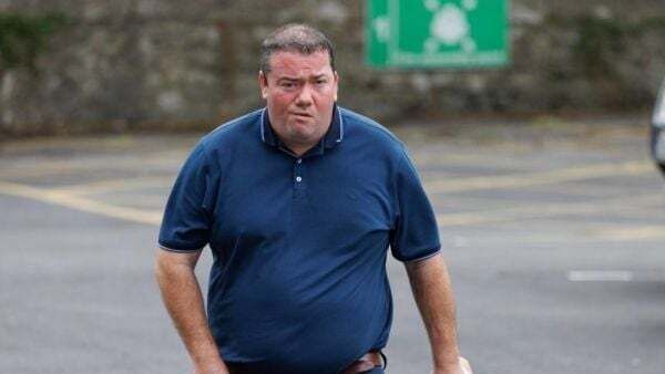 Farmer who threw bag of cow dung towards politician has case to answer, judge says