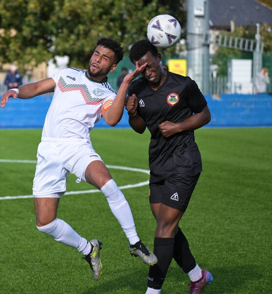 Mayo League captain Jordan Loftus gets his head to the ball before Sligo/Leitrim’s Saeedi Tumumeirwe. Mayo League captain Jordan Loftus gets his head to the ball before Sligo/Leitrim’s Saeedi Tumumeirwe.