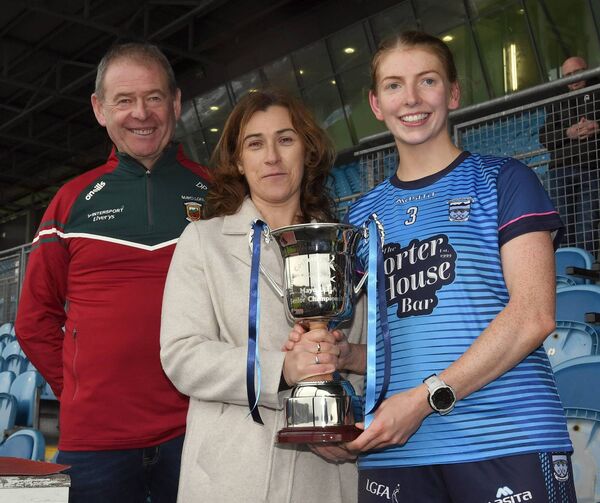 Michelle Corbett presents the Jimmy Corbett Perpetual Cup to Westport ladies team captain, Janette O’Malley, after the LGFA Mayo SFC final at Hastings Insurance MacHale Park last Sunday. Also included is Des Phillips, Chairman, Mayo LGFA. Picture: David Farrell Photography Michelle Corbett presents the Jimmy Corbett Perpetual Cup to Westport ladies team captain, Janette O’Malley, after the LGFA Mayo SFC final at Hastings Insurance MacHale Park last Sunday. Also included is Des Phillips, Chairman, Mayo LGFA. Picture: David Farrell Photography