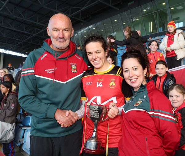 Liam McHale presents the cup to captain Gráinne Flynn after Castlebar Mitchels defeated Louisburgh in the Mayo LGFA Intermediate Final.	Picture: Michael Donnelly