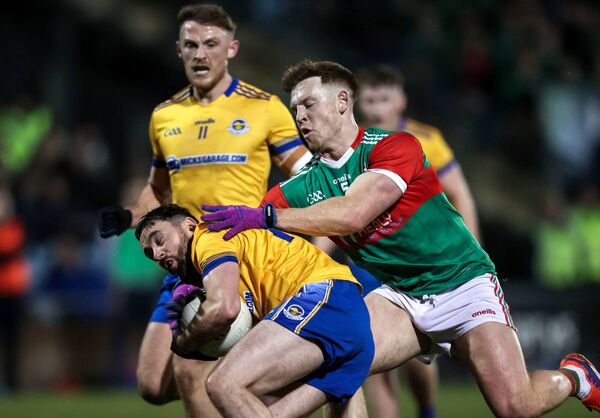 Knockmore's Keith Ruttledge is challenged by Sean Regan of Ballina Stephenites. Picture: INPHO/Tom Maher Knockmore's Keith Ruttledge is challenged by Sean Regan of Ballina Stephenites. Picture: INPHO/Tom Maher