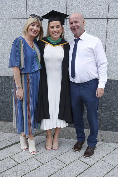 Niamh O’Neill, Ballyhaunis, with her parents Stella and George after she received a Bachelor of Science in Physical Education and Maths during the recent graduation ceremony at Dublin City University. Picture: Kyran O’Brien/DCU Niamh O’Neill, Ballyhaunis, with her parents Stella and George after she received a Bachelor of Science in Physical Education and Maths during the recent graduation ceremony at Dublin City University. Picture: Kyran O’Brien/DCU