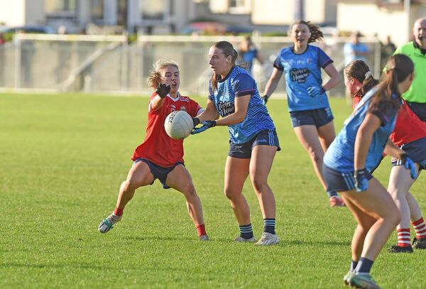 Westport's Aoife Kennedy gets a pass away despite the attention of Kilkerrin Clonberne's Lynsey Noone. Picture: Conor McKeown Westport's Aoife Kennedy gets a pass away despite the attention of Kilkerrin Clonberne's Lynsey Noone. Picture: Conor McKeown