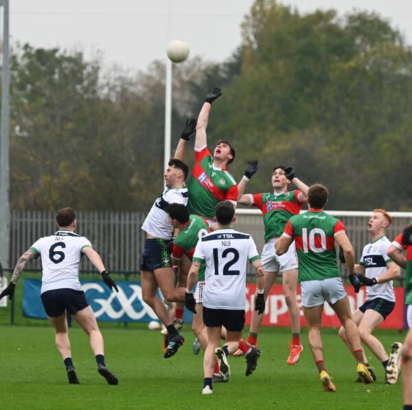 Frank Irwin of Ballina Stephenites rises above the crowd to try and break possession in his side's favour. Frank Irwin of Ballina Stephenites rises above the crowd to try and break possession in his side's favour.