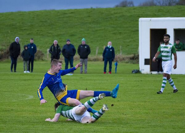 Castlebar Celtic's Oran Groarke gets under Cloonfad United's Matty Freyne. Castlebar Celtic's Oran Groarke gets under Cloonfad United's Matty Freyne.