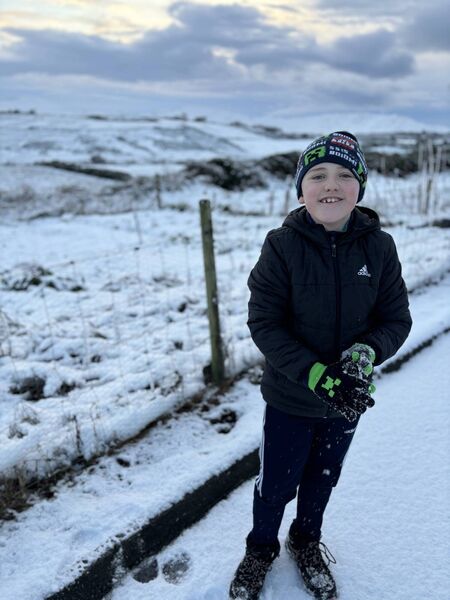 Tommy McGowan visiting his nanny and grandad in Ballycroy having ‘the best snow day of his life’.