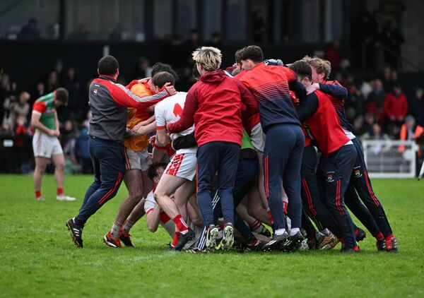 Coolera-Strandhill's Ross Doherty is mobbed by his ecstatic teammates after scoring the winning penalty in the Sligo side's shoot-out with Ballina Stephenites at the end of their Connacht Club SFC semi-final at Markievicz Park.	Picture: INPHO