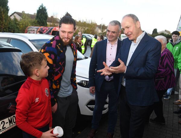 Tánaiste Micheál Martin chats with Padaig and Caiden O'Hora while canvassing in Ballina on Sunday with Minister of State Dara Calleary TD. 	 Picture: John O'Grady
