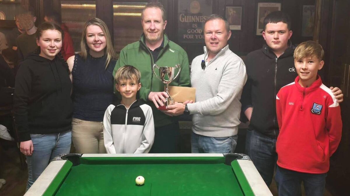 Local Notes: Langan family, Belmullet present the Derek Langan Memorial Pool competition trophy 